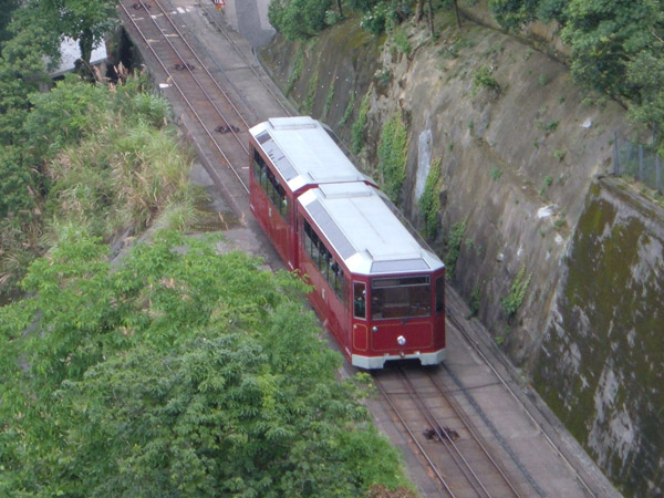 A Peak Tram descending towards an intermediate station in Central, Hong Kong.